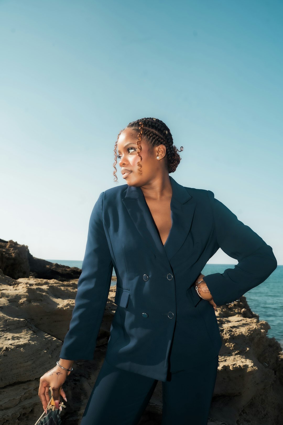 Belgian business consultant in a navy blazer looking confidently at the camera